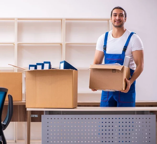 Mover with packed boxes and a dolly, ready for efficient transport.