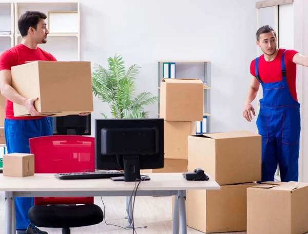 Redmond WA reliable moving company team packs and organizes boxes in an office space efficiently.